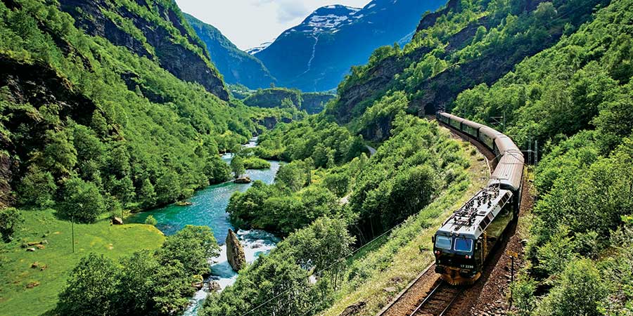 See fantastic scenery and rushing waterfalls on the iconic Flåm Railway
